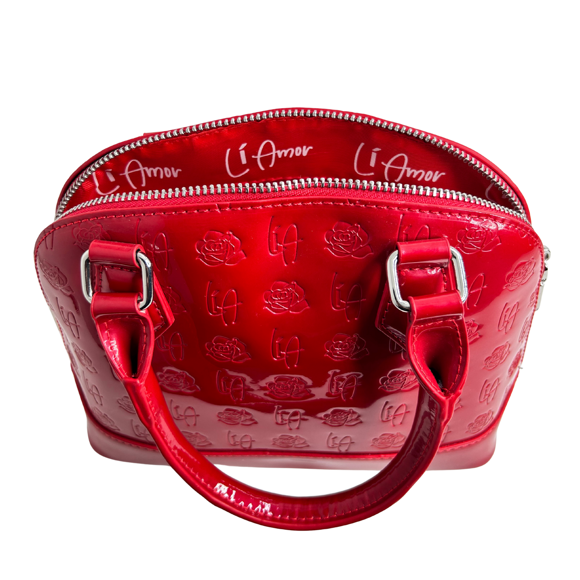 Li Amor small, shell shape, Patent Leather, glossy red Rose handbag with silver hardware. It is lined with the Li Amor logo in crisp white